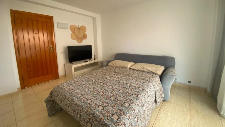 Sofa bed opened as a double bed with smart TV, Los Tajinastes apartment